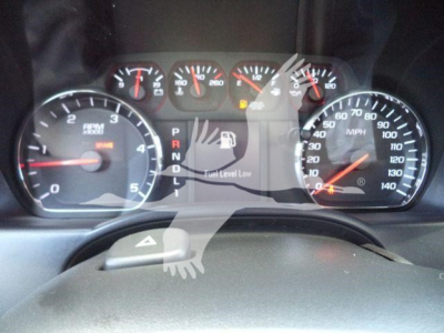 Dashboard view of a Chevrolet Silverado 6500HD showing tachometer, speedometer, gear indicator PRNDL, fuel gauge, and warning lights.