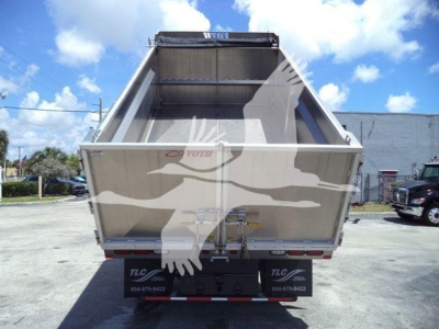 Dump truck bed of a 2023 Chevrolet Silverado 6500HD dump truck showing empty cargo bed and rear view, no visible text readable on the tailgate.