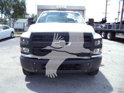 Chevrolet Silverado 6500HD chassis truck front view with black grille and large bumper.