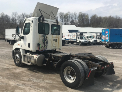 Freightliner Cascadia113 truck tractor sidelooking at the cab and rear chassis with fifth wheel and exposed components
