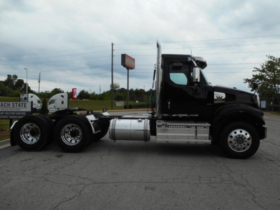 Western Star 49X truck side view showing cab and chassis with dual rear axles and fuel tanks
