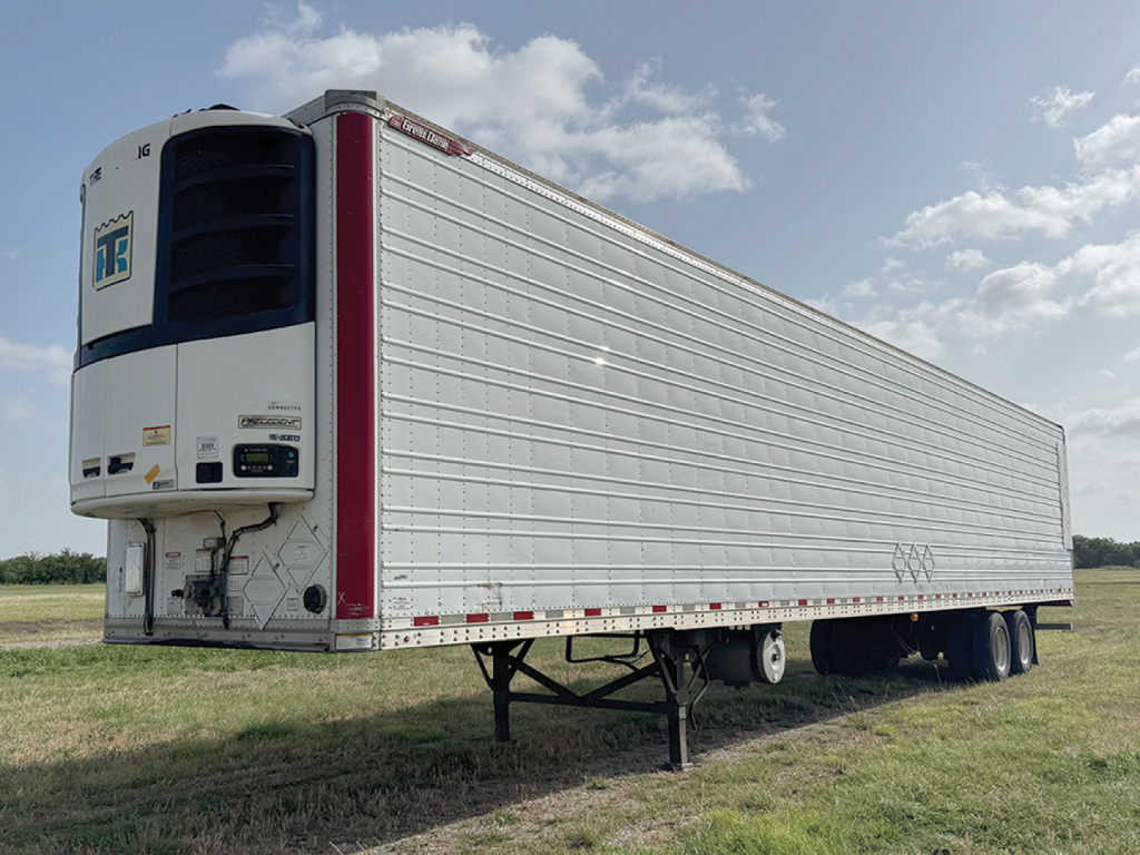 Great Dane Everest SS trailer showing refrigerated unit and side panels in a field.