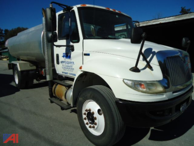 International MA025 DuraStar 4300 fuel tanker truck in white, front-left view showing cab, tanker, and side steps.