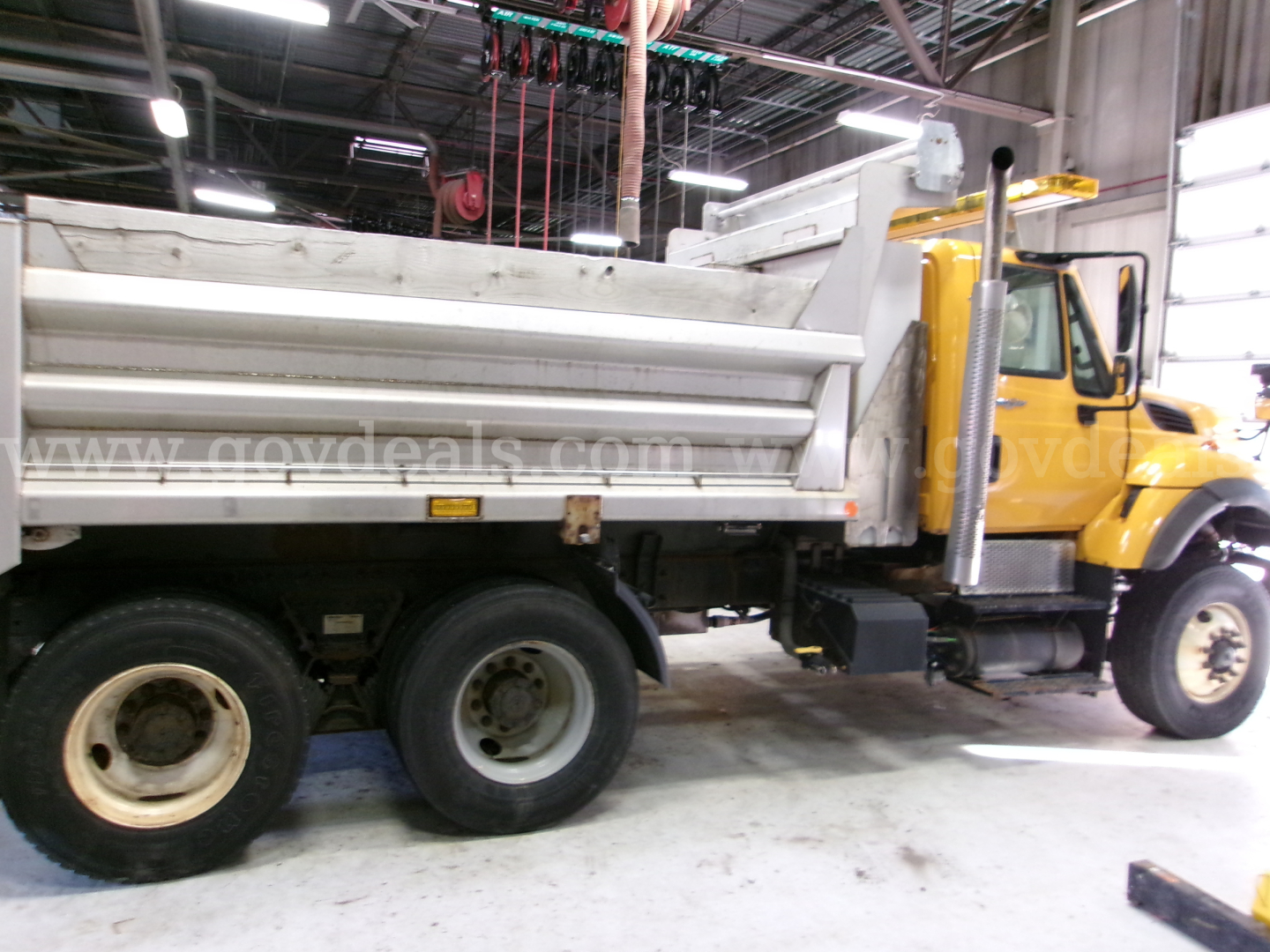 Dump truck showing side view of cargo bed and cab. Exterior labels not legible.