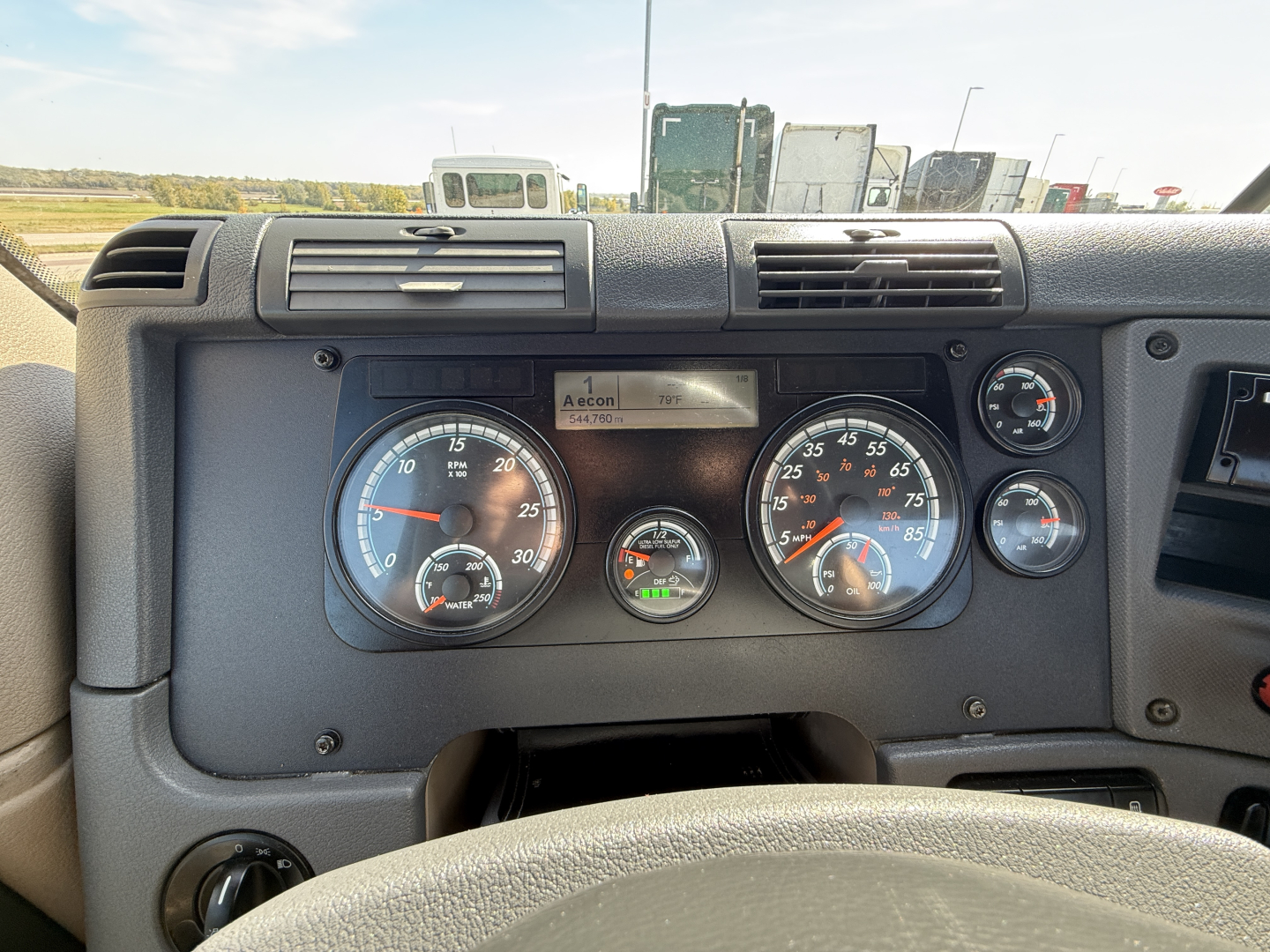 Truck dashboard of a 2018 Freightliner CA12564DC showing gauges and control panel with speedometer, tachometer, and warning lights.