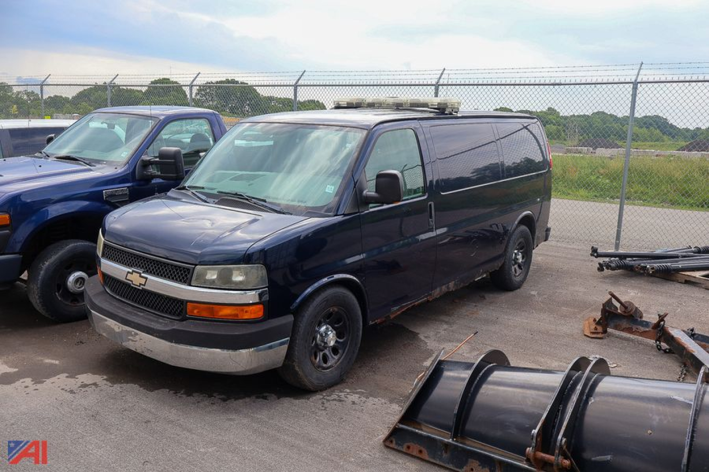 Chevrolet Express cargo van in a lot with front grille and Chevrolet emblem visible