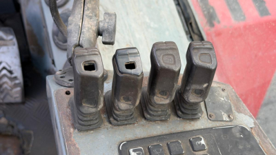 Kalmar DCG160-6T truck lift control levers and warning panel showing five rocker switches.
