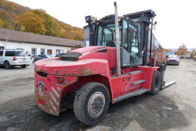 Kalmar DCG160-6T forklift in-side view showing red body, enclosed operator cab, large front/rear tires, and side steps.