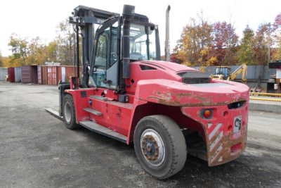 Kalmar DCG160-6T forklift in service showing side view with worn red paint and cab, VIN B40500010 on listing card