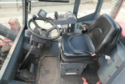 Kalmar DCG160-6T operator cabin showing steering wheel, seat, and controls.