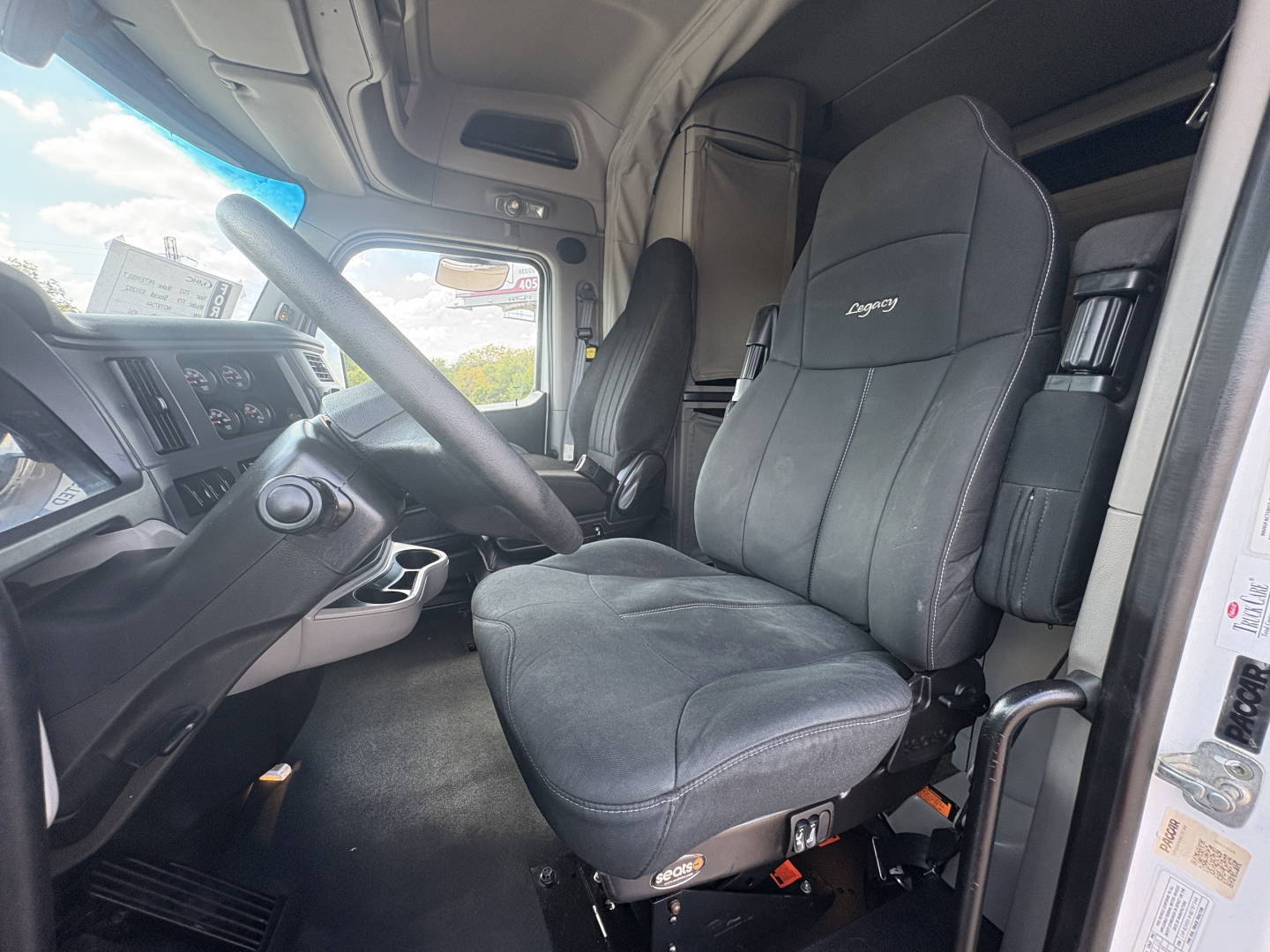 Peterbilt 579 truck cab interior showing driver's seat and steering wheel
