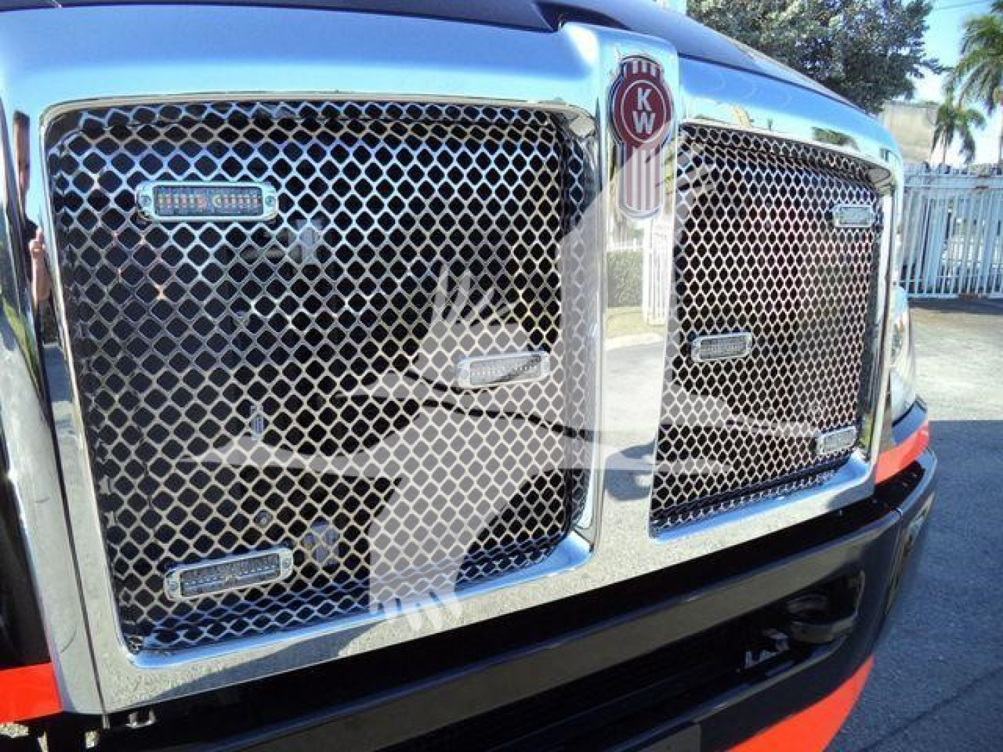 Kenworth T280 truck grille with dual mesh chrome grilles and KW emblem, front view.