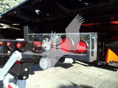 Kenworth T280 rollback hitch assembly with mirror and lights in the rear, showing mounting hardware and bumper area.