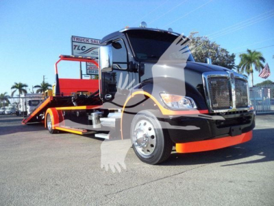 Kenworth T280 rollback truck in black with orange accents, front grille, chrome bumper, and flatbed rollback bed visible.
