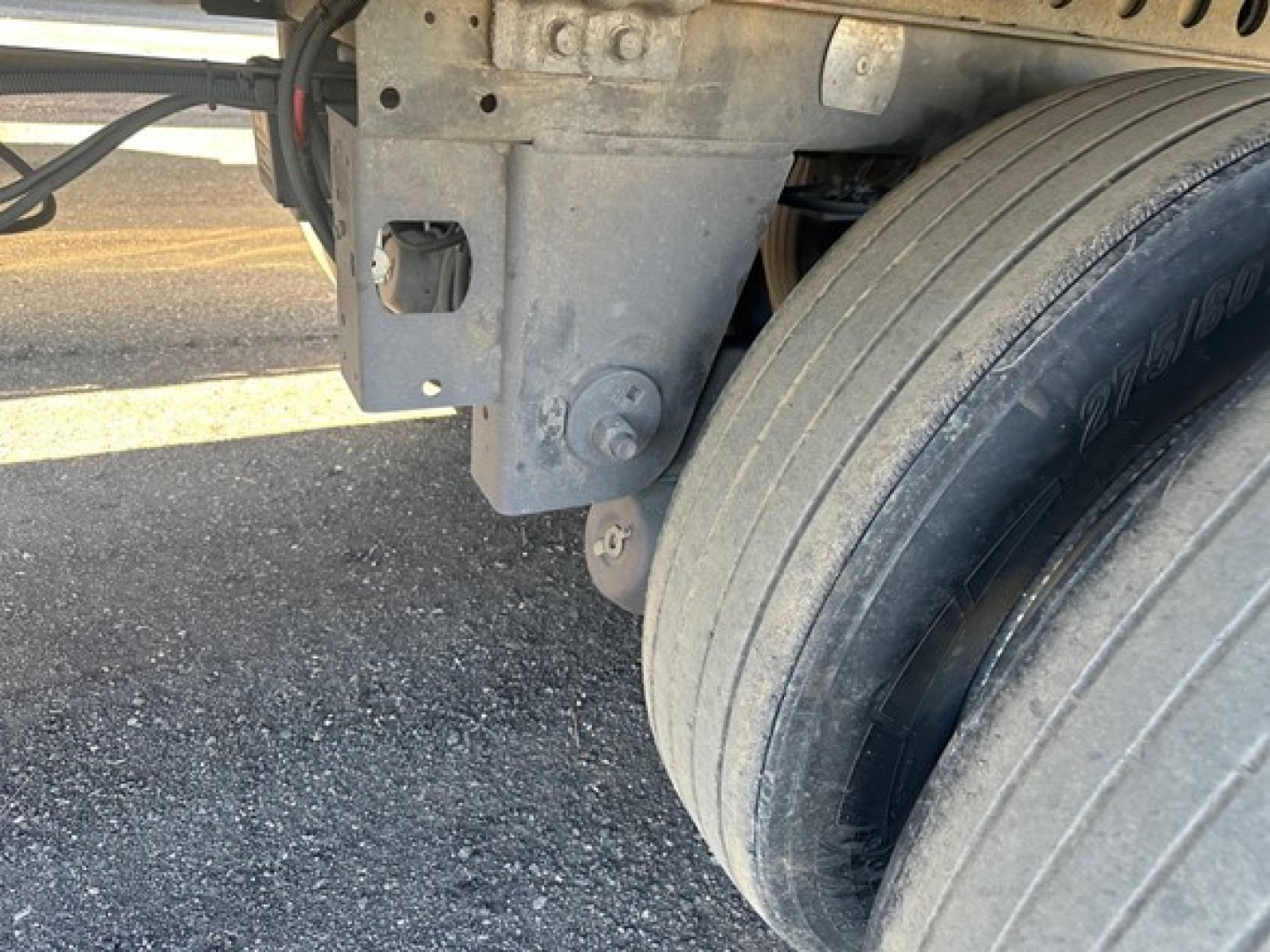 Trailer undercarriage showing dual rear tires and suspension mounting on a 2015 Hyundai air ride dry van.