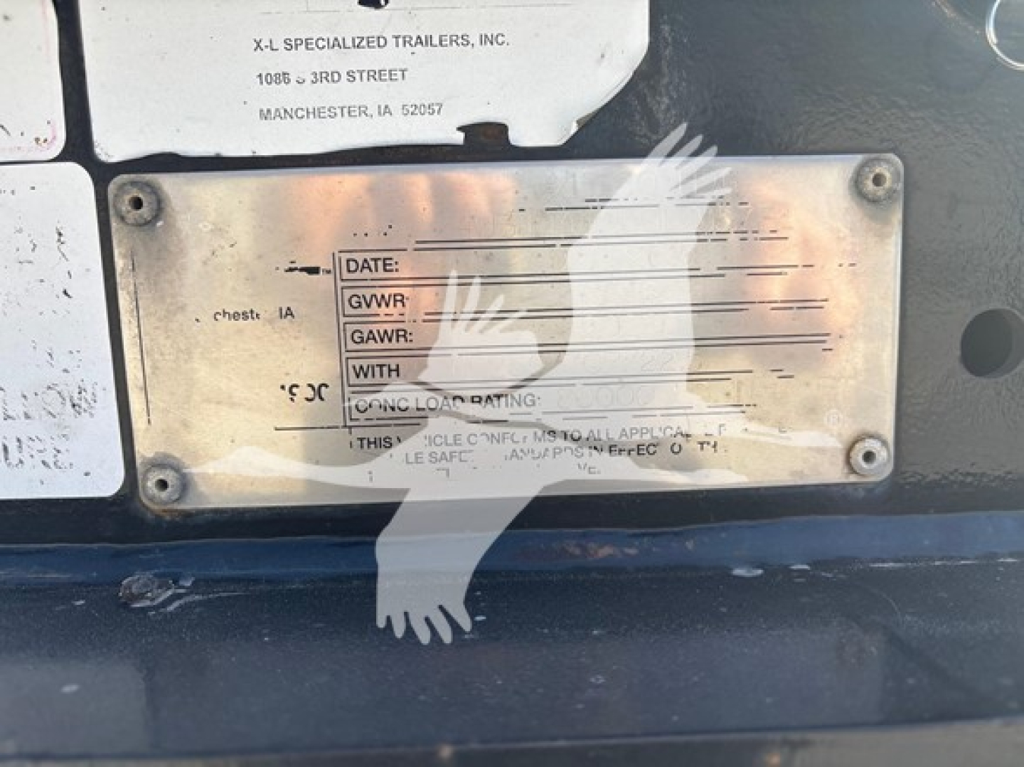 Trailer identification plate on XL Specialized XL80HDG showing blank fields for DATE, GVWR, GAWR, WITH something, and towing rating.