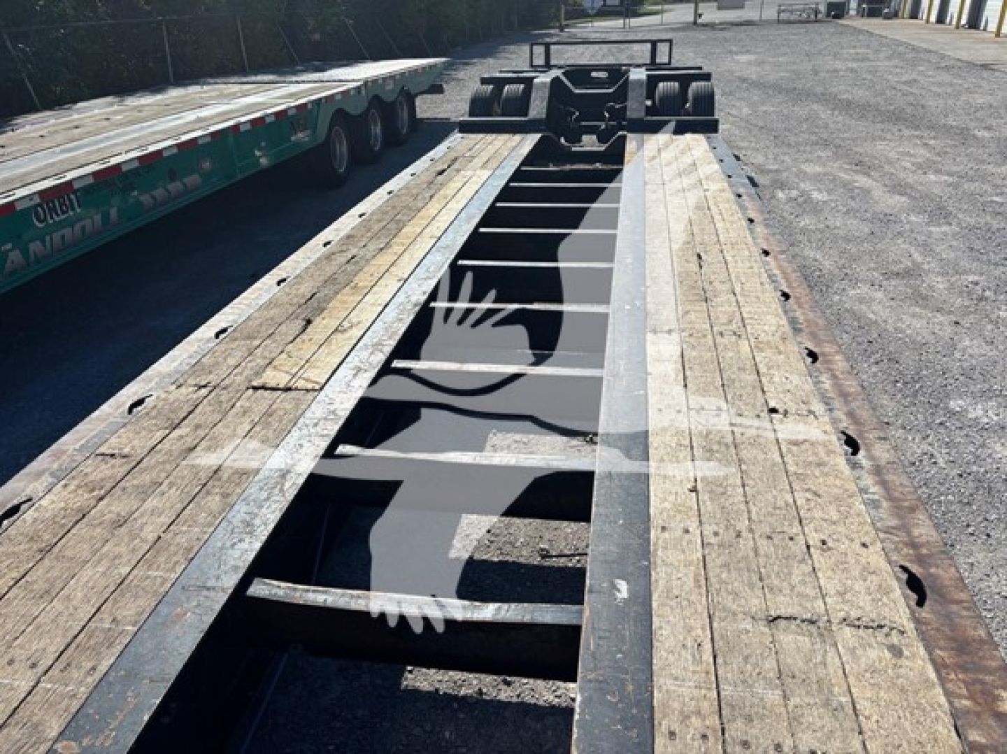 XL Specialized XL80HDG lowboy trailer frame showing wood deck and central steel channel