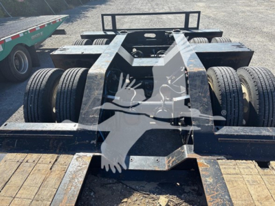 Trailer chassis showing XL Specialized XL80HDG lowboy with dual rear axles and wooden deck, viewed from above.
