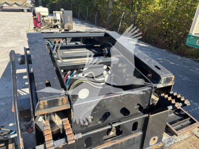 Trailer chassis in-view showing hydraulic and drive components with tracks at the sides and metal frame, 2016 XL Specialized XL80HDG lowboy trailer.