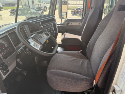 Cab interior of a 2020 Mack AN64T Daycab showing steering wheel, dashboard, and front seat.