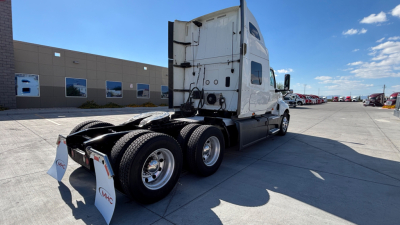 Truck tractor rear three-quarter view showing fifth wheel and dual rear axles for a 2021 International LT625.