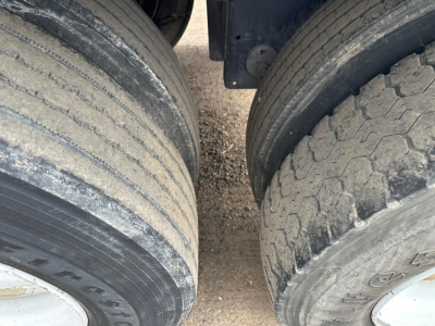 Tires of aTimpte Super Hopper trailer with 78" sides, showing dual axles and tread wear.