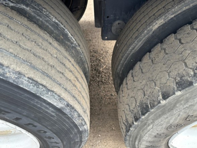 Timpte Super Hopper trailer wheels and dual tires viewed from top angle, showing tread and sidewall details.