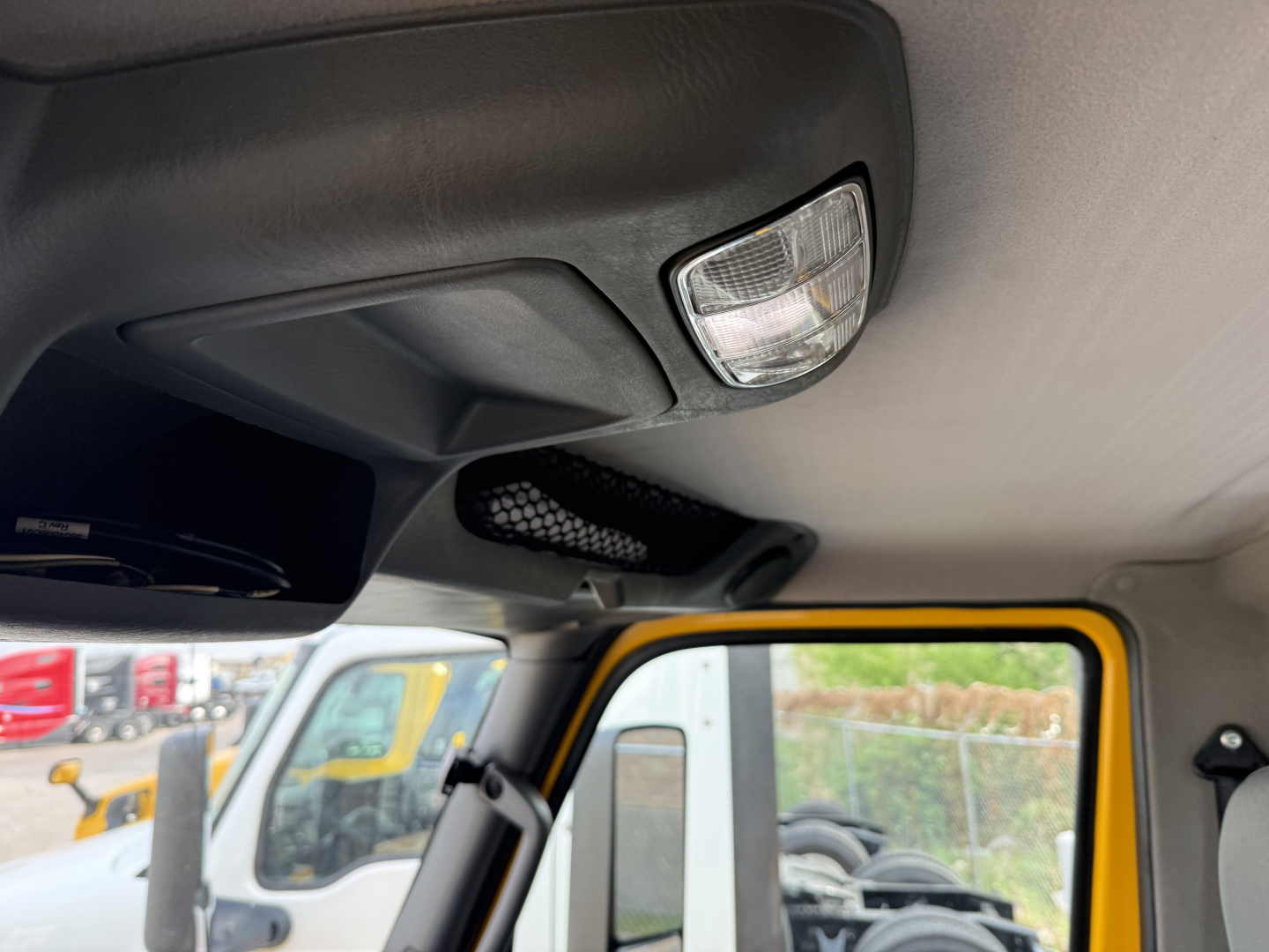 Cab interior of a 2019 International LT daycab showing overhead console and interior light.