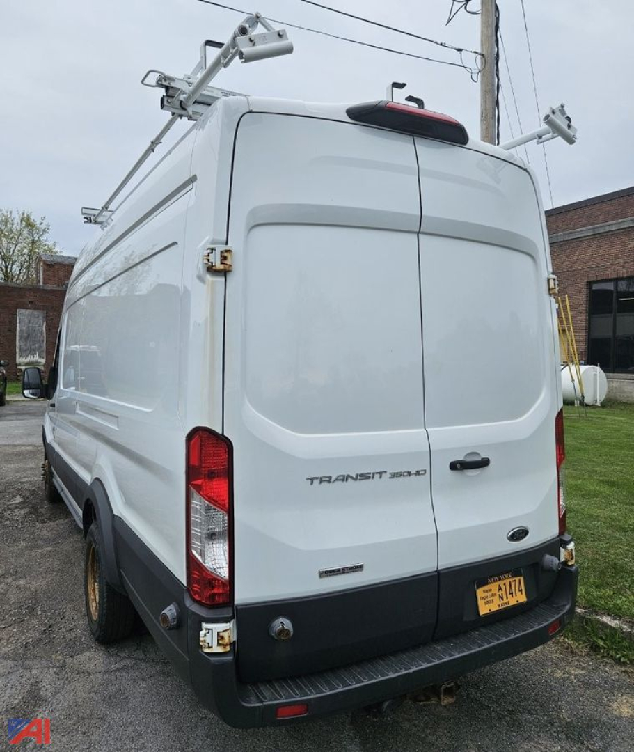 Transit 250 cargo van rear view showing double doors with roof racks and yellow license plate.