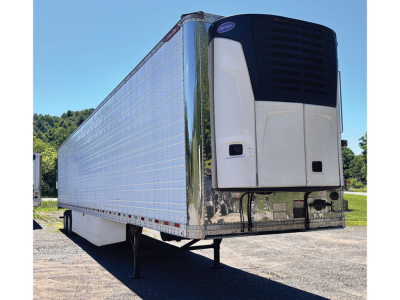 Great Dane Everest SS trailer with white front refrigeration unit and chrome undercarriage, side view showing reefer trailer.