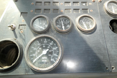Kalmar Ottawa YT30 truck dashboard cluster with speedometer and multiple gauges in metal panel.