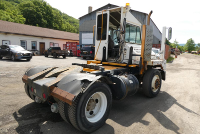 Kalmar Ottawa YT30 yard truck rear/driver side view showing cab, chassis, and coupling area with tires and rear deck.