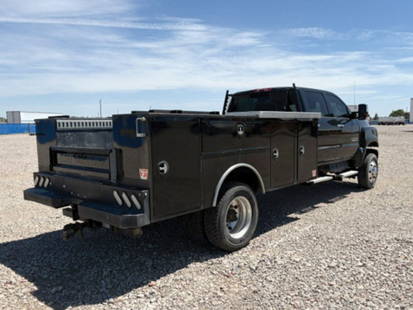 Chevrolet 4500 Silverado HD service/utility pickup truck rear three-quarter view showing utility bed and dual rear wheels.