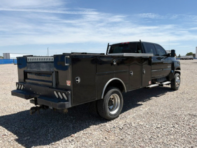 Chevrolet 4500 Silverado HD service/utility pickup truck rear three-quarter view showing utility bed and dual rear wheels.