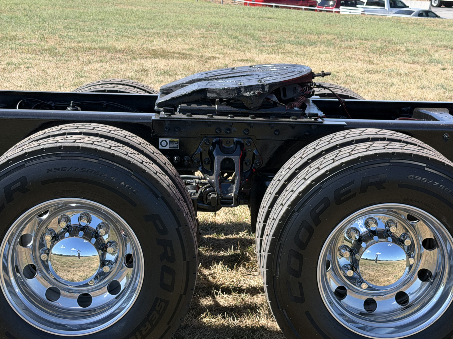 Kenworth T680 tractor-trailer chassis with dual rear wheels and fifth wheel removed. Chrome wheels and Goodyear tires visible.