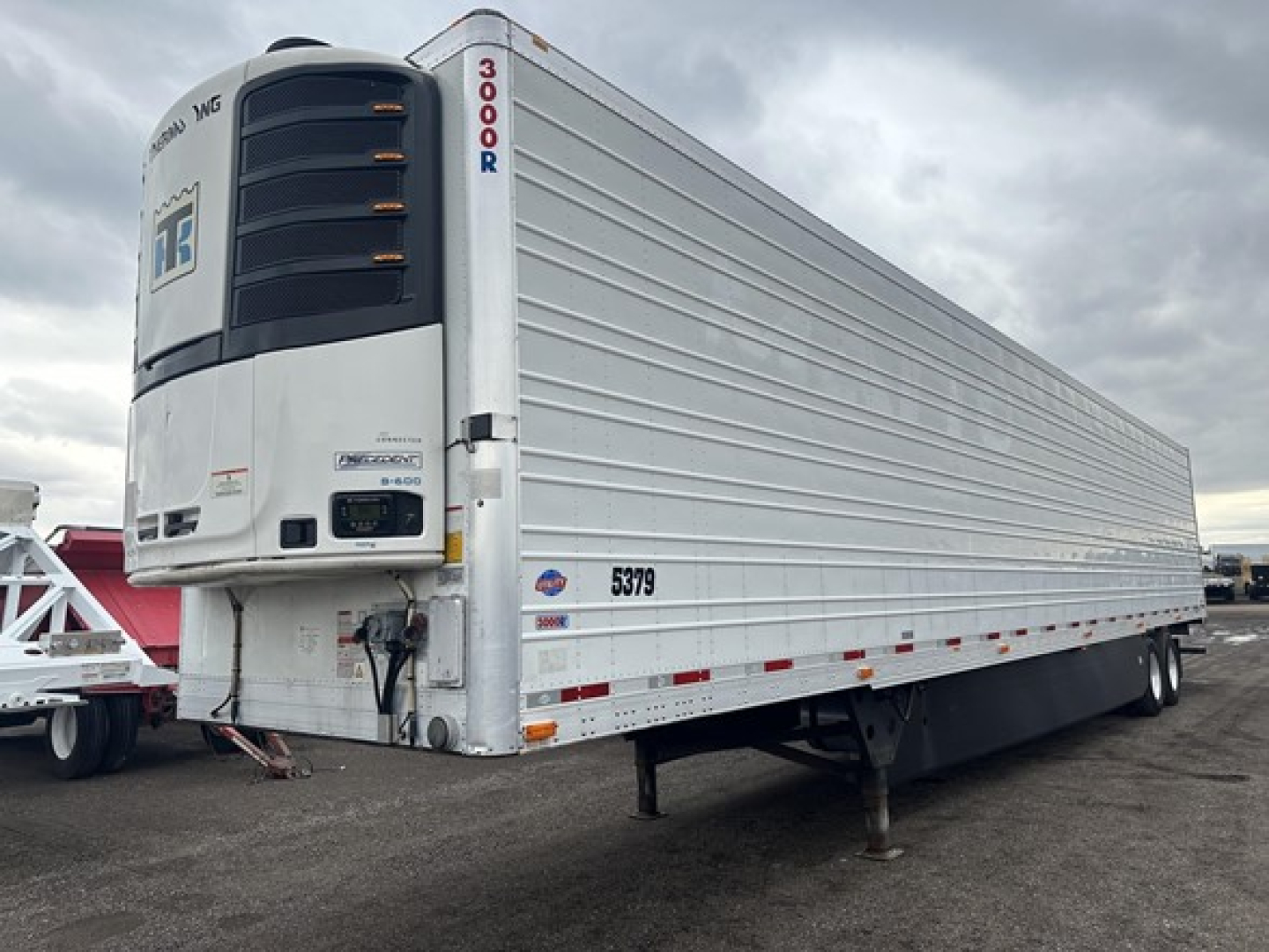Utility 3000R refrigerated trailer showing rear doors and front refrigeration unit, white with SR 5379 and TR ICG branding visible.