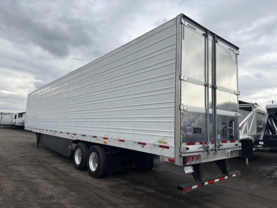 Trailer side view of a 2023 Utility 3000R reefer trailer with aluminum exterior, tandem axles, and rear doors.