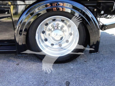 Wheel of a 2022 International MV rollback truck with polished chrome rim and black fender
