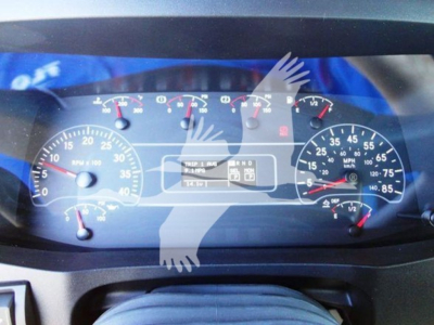 Dashboard of a 2022 International MV showing gauges and warning lights with a central digital display.