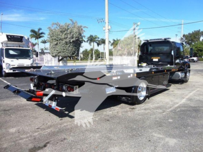 Flatbed tow truck with MV series International rollback chassis. Visible text includes VIN 3HAEUMML7ML615011, Stock J15011, Category Rollback, Type Trucks, NewUsed New.