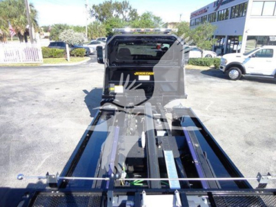 Tow truck body showing MV heavy-duty rollback equipment and hydraulic frame