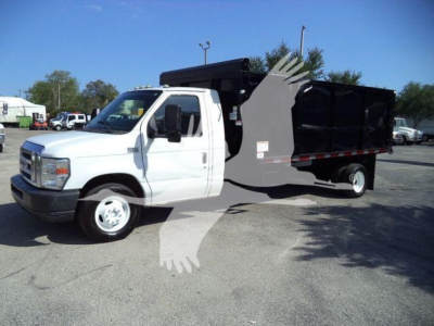 White Ford E-450 dump truck with black dump bed, side view showing cab and hydraulic lift; no legible stickers or small text visible.