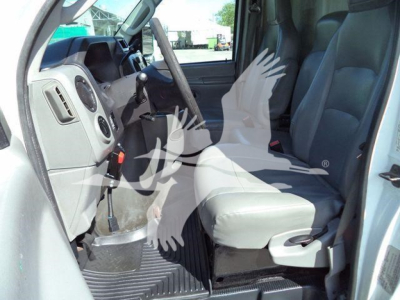 Ford E-450 cargo van interior front seats and driver area view showing gray seats and dashboard