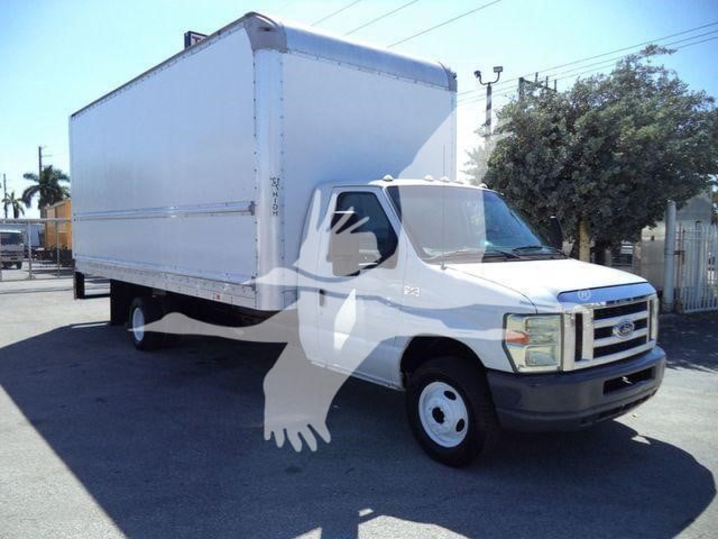Box truck with a large cargo box on Ford E-350 chassis, front grille with Ford emblem, standard white cab, no visible markings on sides.