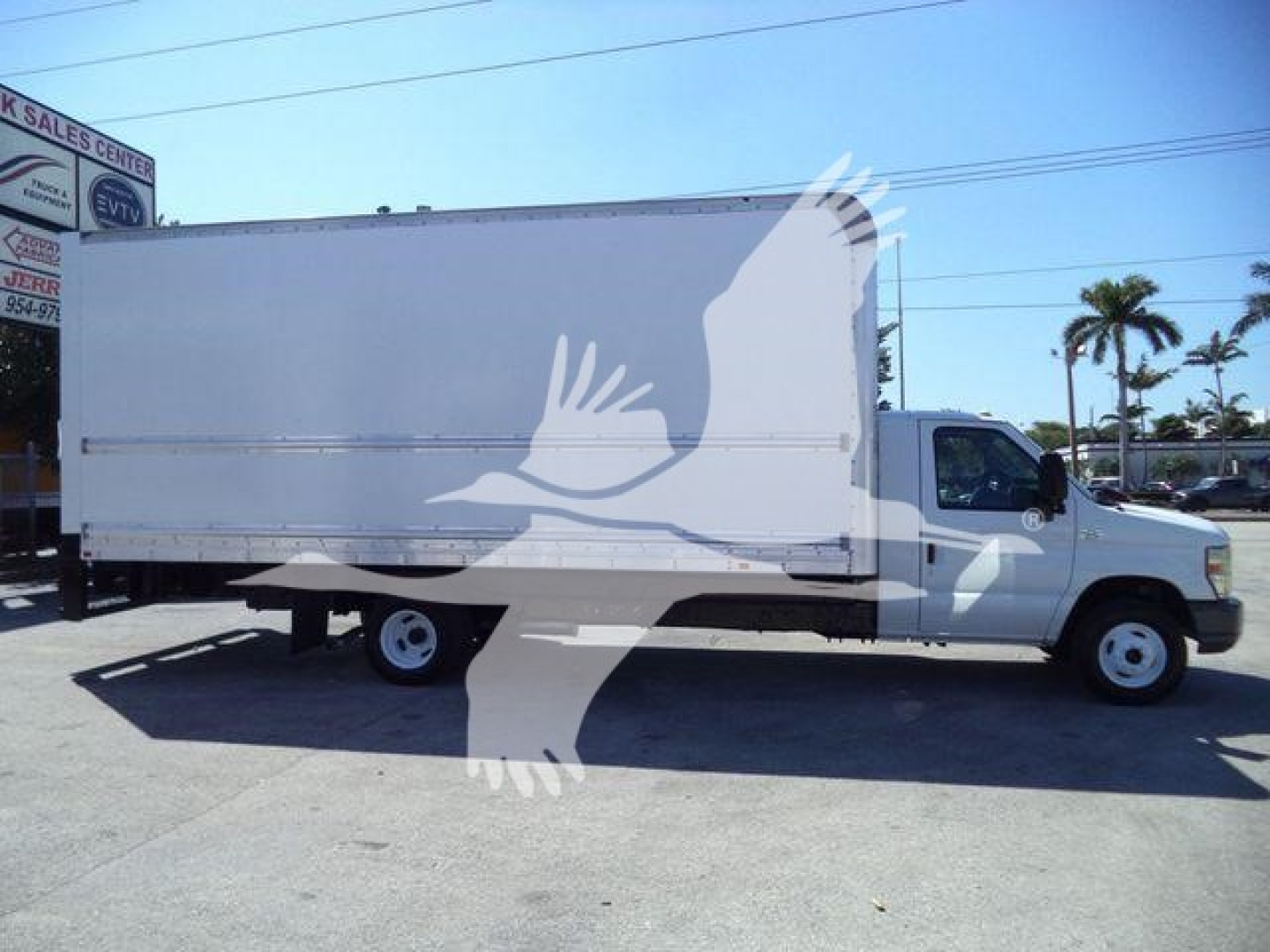 Ford E-450 box truck in-service showing side profile with large cargo box and cab, VIN 1FDXE4FS6BDA96725 not visible in image.