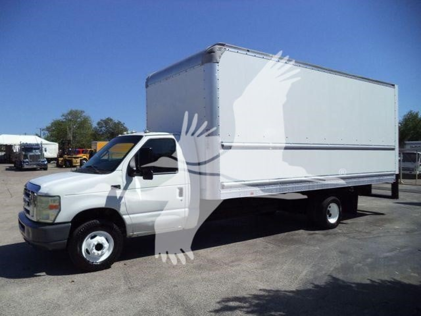 Ford E-450 box truck with white cab and large rectangular cargo box, side view, clear sky.