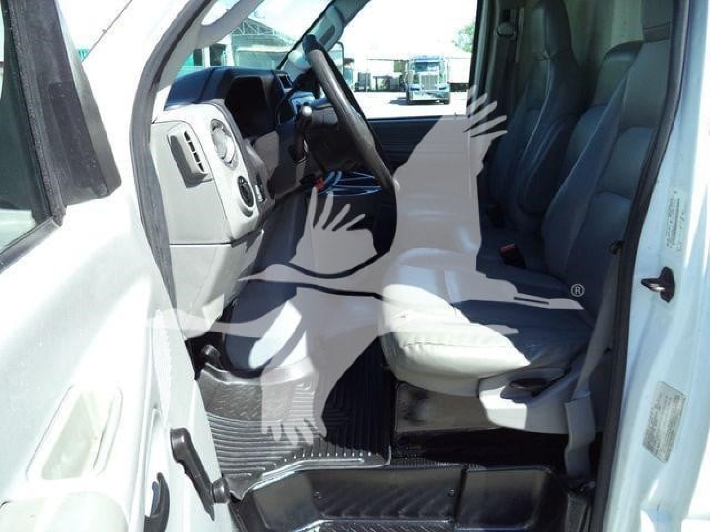 Ford E-450 van interior with front seats and dashboard visible.