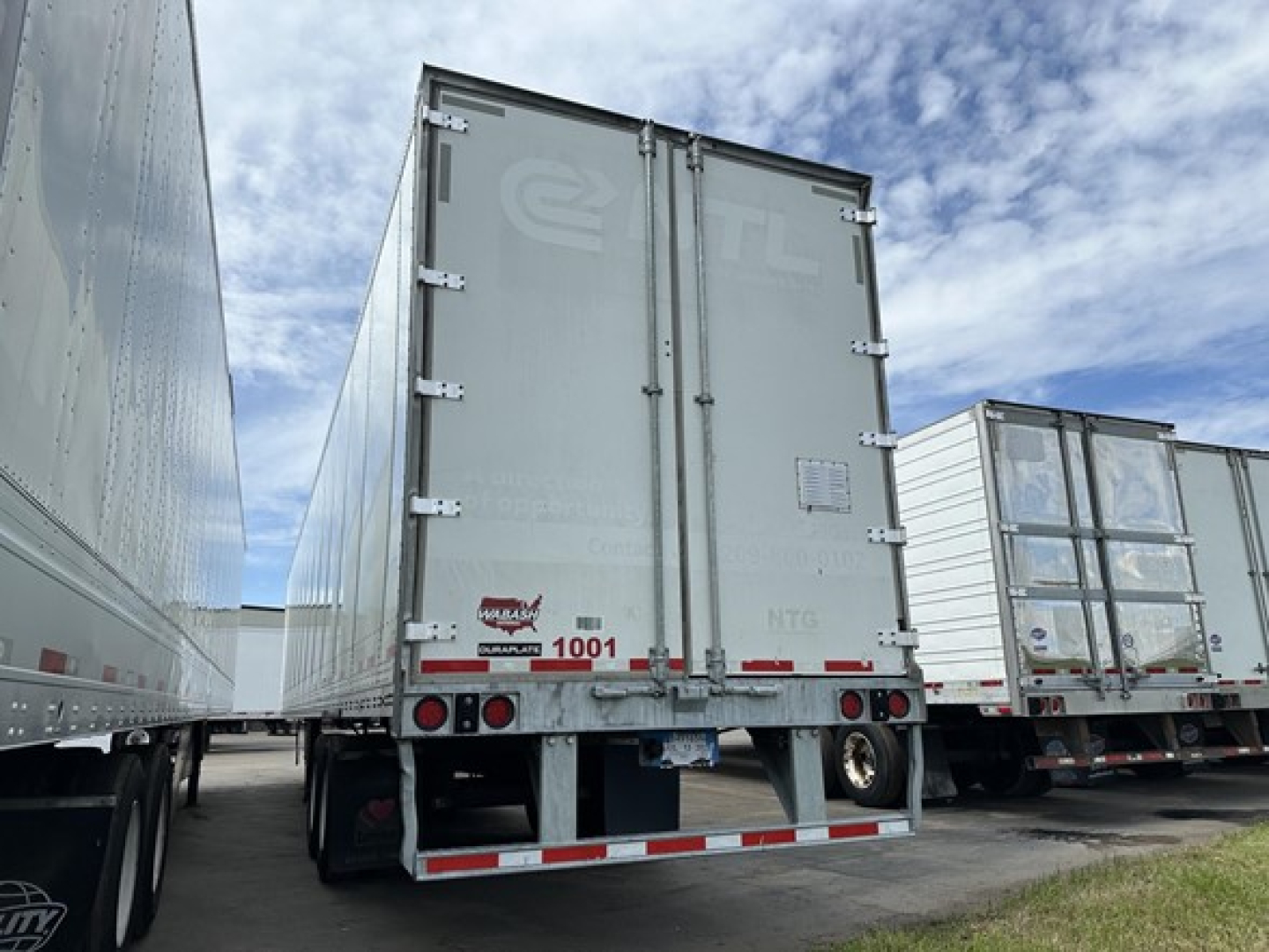 Rear view of a 2022 Wabash Duraplate 53' air ride dry van trailer showing rear doors, taillights, bumper, and reflective tape.