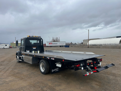 Mack MD6 rollback truck with flatbed and hydraulic rear ramps