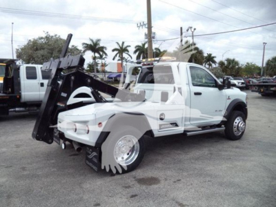 Ram 4500 tow truck with winch equipment mounted, white cab, stock number J98304, VIN 3C7WRLAL4RG398304, parked lot
